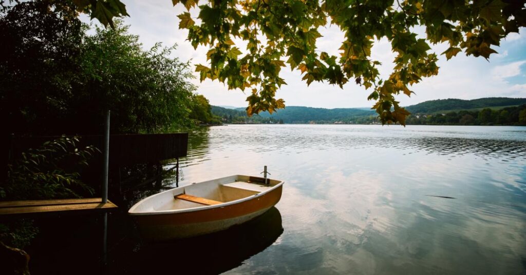 a peaceful lake with a boat